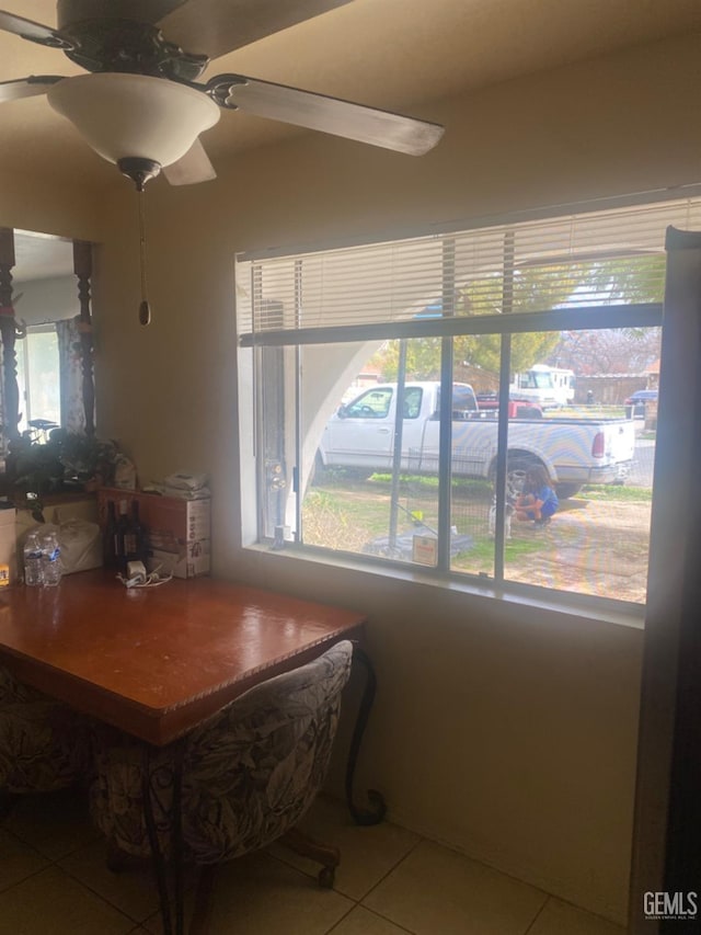 dining room with tile patterned flooring and ceiling fan