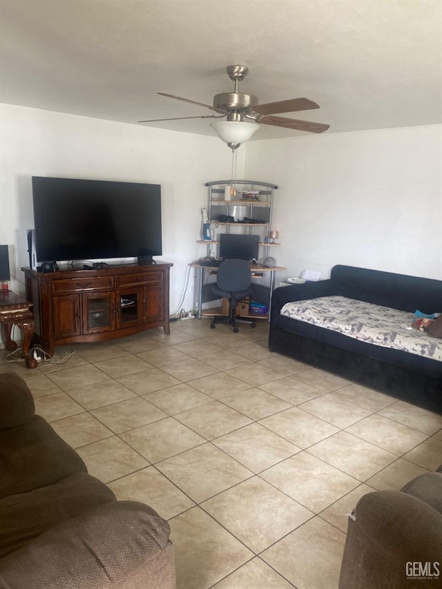 living area with ceiling fan and light tile patterned flooring