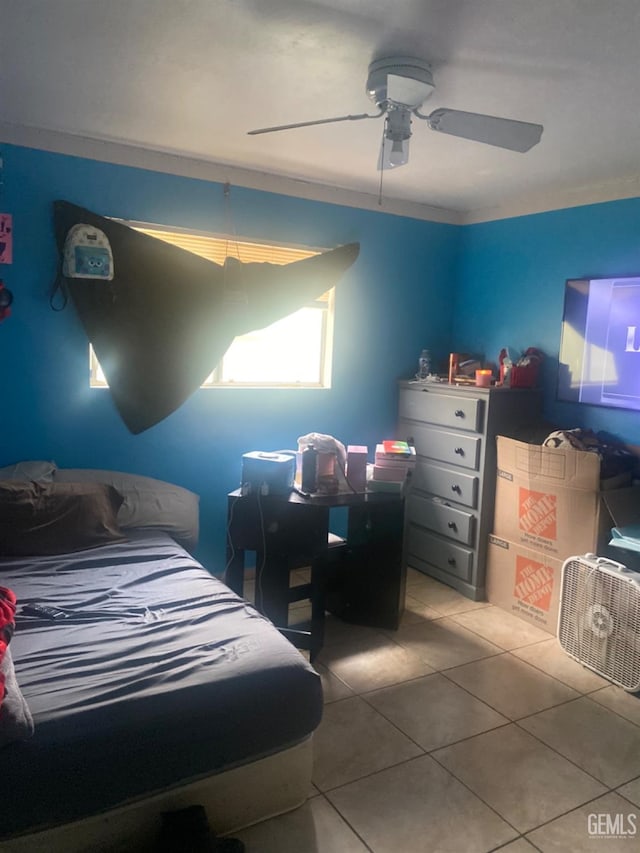 tiled bedroom with ceiling fan