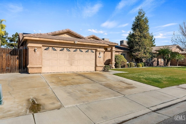 view of front facade with a garage and a front lawn