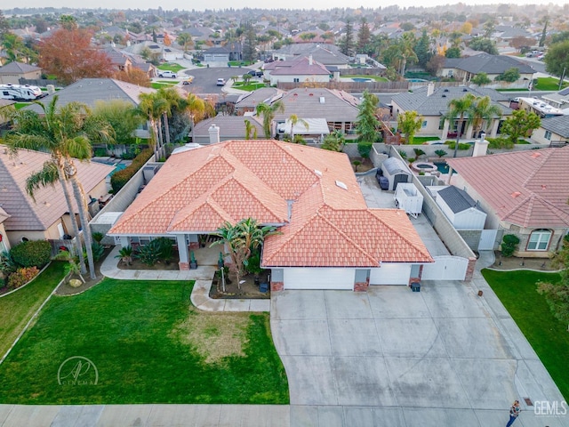 birds eye view of property with a residential view