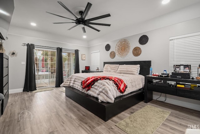 bedroom featuring recessed lighting, wood finished floors, a ceiling fan, baseboards, and access to outside