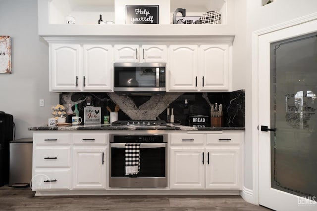 bar with appliances with stainless steel finishes, backsplash, and wood finished floors