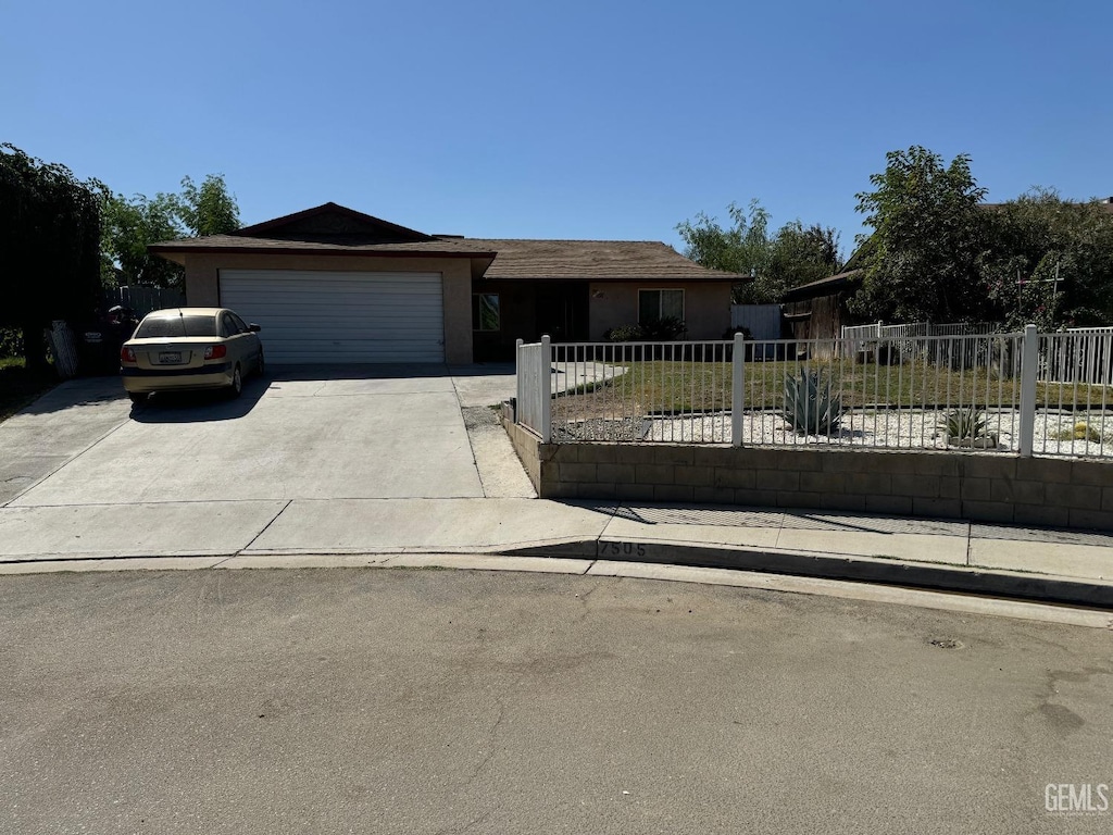 ranch-style house featuring a garage