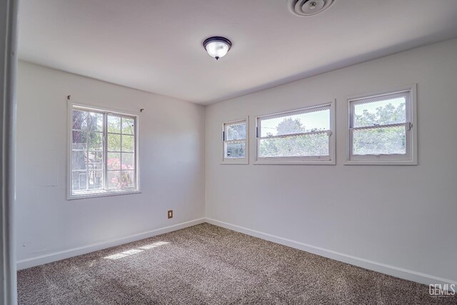 201 Cedar St, Bakersfield, CA 93304 - carpeted empty room with baseboards