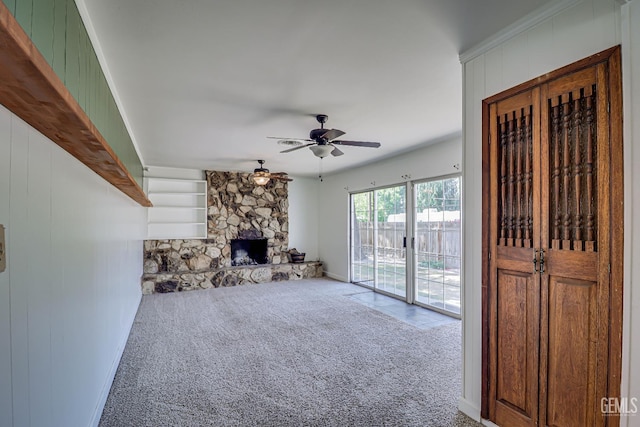 201 Cedar St, Bakersfield, CA 93304 - unfurnished living room featuring carpet flooring, ceiling fan, a fireplace, and baseboards