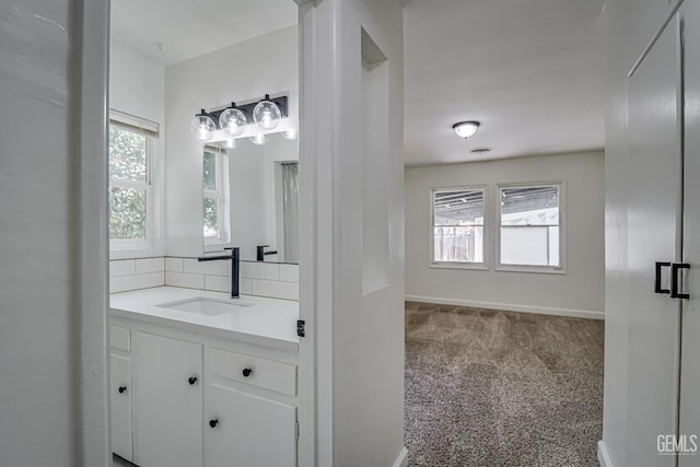 201 Cedar St, Bakersfield, CA 93304 - bathroom with vanity, healthy amount of natural light, and baseboards
