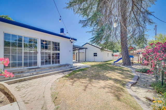 201 Cedar St, Bakersfield, CA 93304 - view of yard with a playground and entry steps