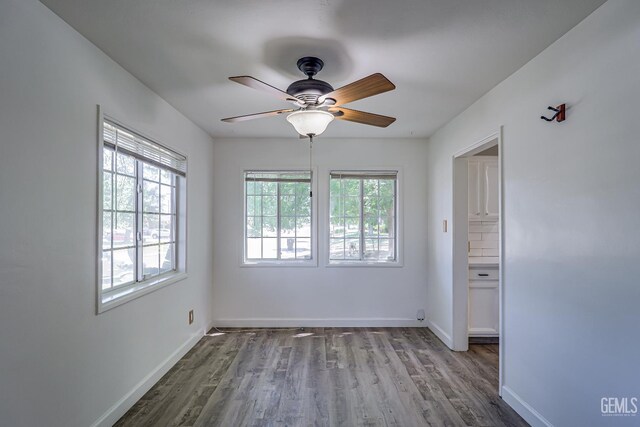 201 Cedar St, Bakersfield, CA 93304 - empty room with ceiling fan, wood finished floors, and baseboards