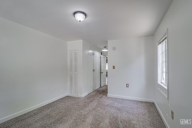 201 Cedar St, Bakersfield, CA 93304 - empty room with carpet flooring and baseboards
