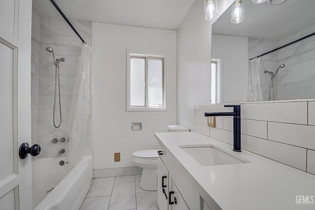 201 Cedar St, Bakersfield, CA 93304 - full bathroom with vanity, shower / bath combination with curtain, toilet, baseboards, and marble look tiles