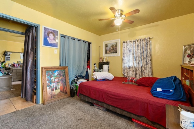 bedroom featuring ceiling fan and carpet flooring