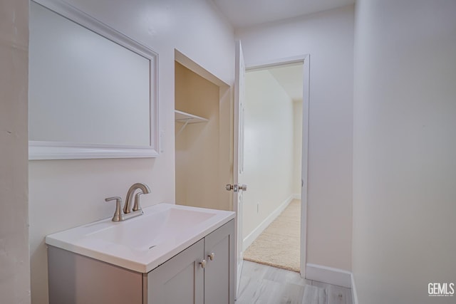 bathroom featuring vanity and hardwood / wood-style flooring