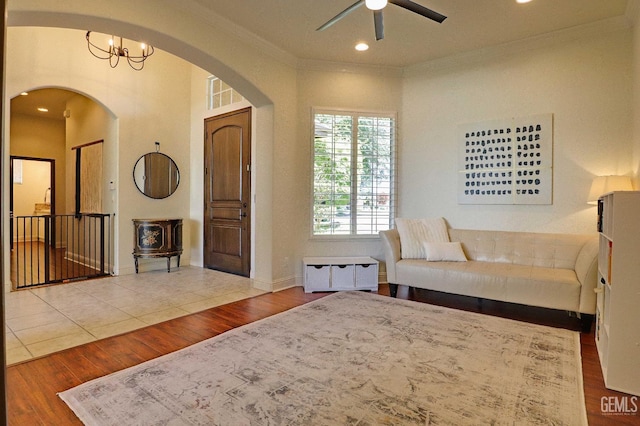 1881 Richert Ave, Clovis, CA 93611 - living area featuring arched walkways, crown molding, ceiling fan, wood finished floors, and recessed lighting