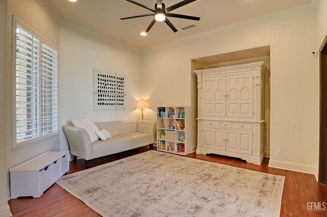 1881 Richert Ave, Clovis, CA 93611 - sitting room featuring radiator heating unit, ceiling fan, crown molding, dark wood-style floors, and recessed lighting