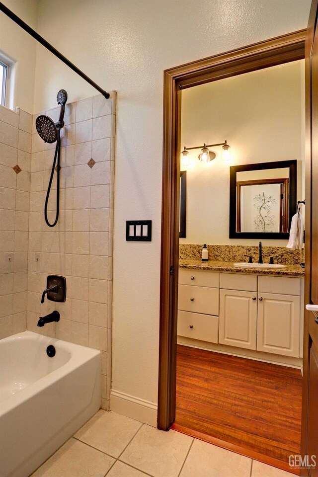 1881 Richert Ave, Clovis, CA 93611 - full bath featuring tile patterned flooring, vanity, and washtub / shower combination