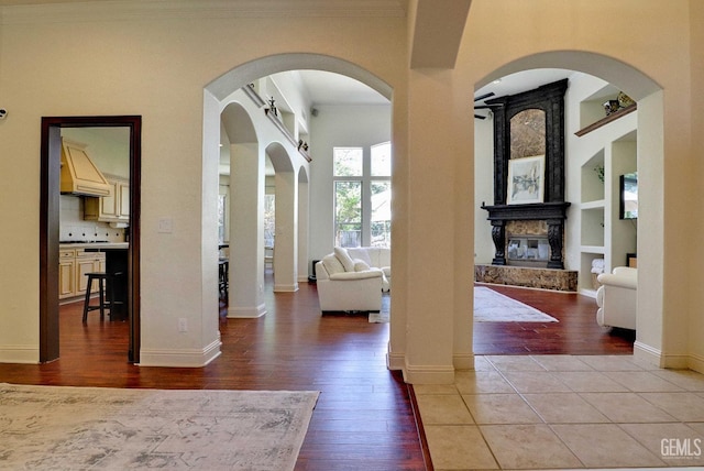 1881 Richert Ave, Clovis, CA 93611 - foyer with wood finished floors, crown molding, and a fireplace