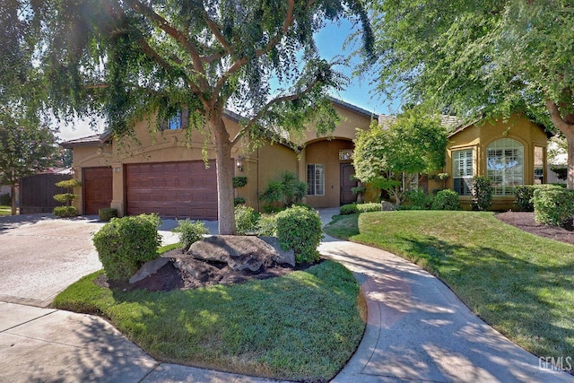 1881 Richert Ave, Clovis, CA 93611 - view of front facade featuring stucco siding, driveway, and a front yard