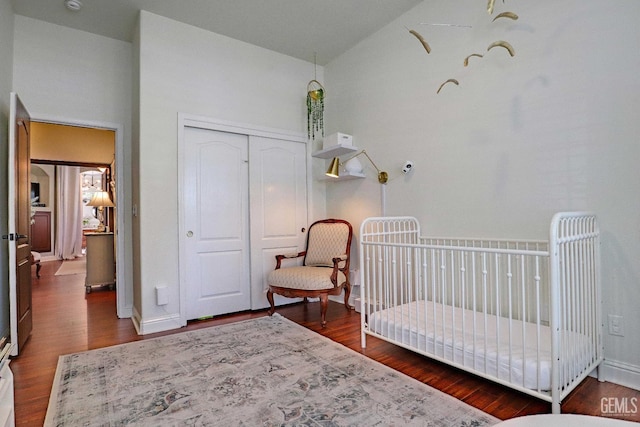 1881 Richert Ave, Clovis, CA 93611 - bedroom with wood finished floors, a closet, high vaulted ceiling, and a crib