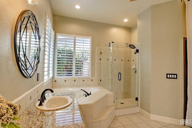 1881 Richert Ave, Clovis, CA 93611 - full bathroom featuring a bath, a shower stall, tile patterned flooring, recessed lighting, and a textured wall
