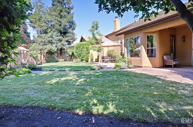 1881 Richert Ave, Clovis, CA 93611 - fenced backyard featuring a patio