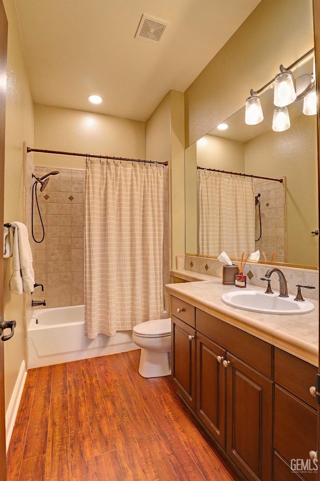 1881 Richert Ave, Clovis, CA 93611 - bathroom with vanity, shower / tub combo with curtain, and wood finished floors