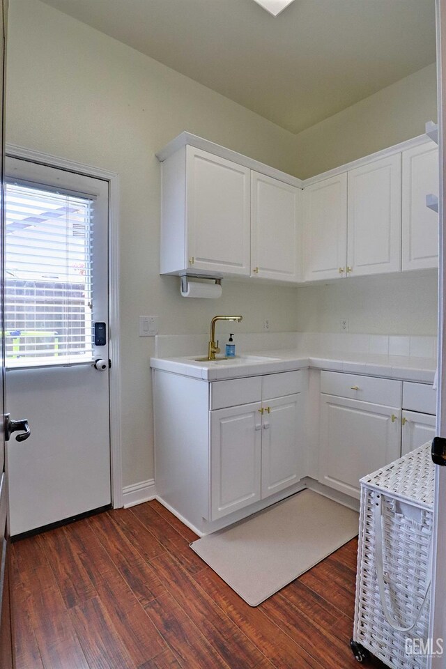 1881 Richert Ave, Clovis, CA 93611 - kitchen featuring white cabinets, light countertops, and dark wood-style floors
