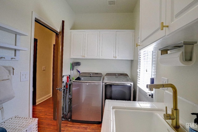 1881 Richert Ave, Clovis, CA 93611 - laundry area featuring independent washer and dryer, cabinet space, and dark wood-style floors