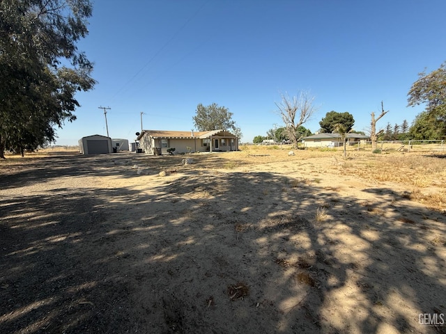 33391 7th Standard Rd, Bakersfield, CA 93314 - view of yard with a garage and an outbuilding