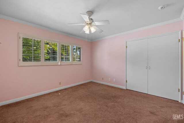 1191 Edmund St, Bakersfield, CA 93309 - unfurnished bedroom featuring carpet, crown molding, ceiling fan, and a closet