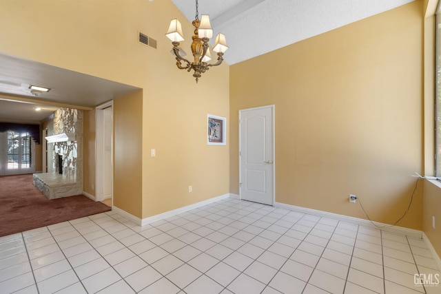 1191 Edmund St, Bakersfield, CA 93309 - spare room with high vaulted ceiling, a chandelier, light carpet, and light tile patterned floors
