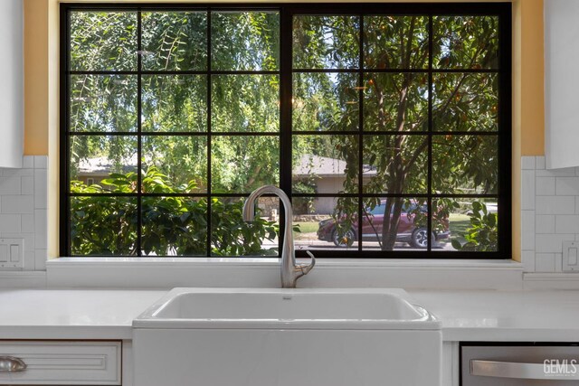 1191 Edmund St, Bakersfield, CA 93309 - kitchen featuring stainless steel dishwasher, light countertops, and plenty of natural light