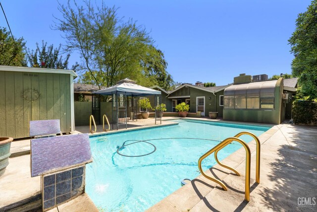 1191 Edmund St, Bakersfield, CA 93309 - view of swimming pool featuring a gazebo