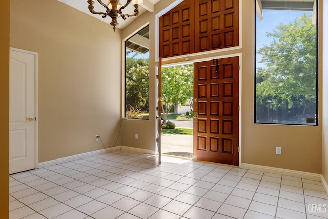 1191 Edmund St, Bakersfield, CA 93309 - entryway featuring a chandelier, healthy amount of natural light, and light tile patterned flooring