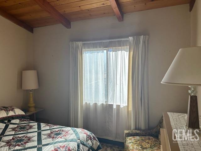 bedroom featuring beam ceiling and wood ceiling