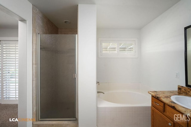 5605 Meadow Valley Ct, Bakersfield, CA 93312 - full bathroom with plenty of natural light, a stall shower, vanity, and a bath