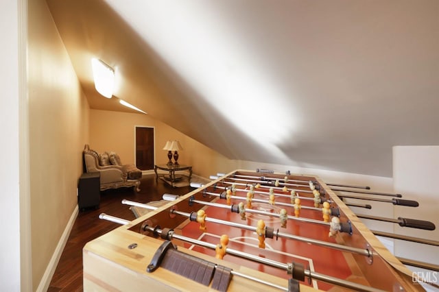 recreation room featuring dark hardwood / wood-style flooring and lofted ceiling