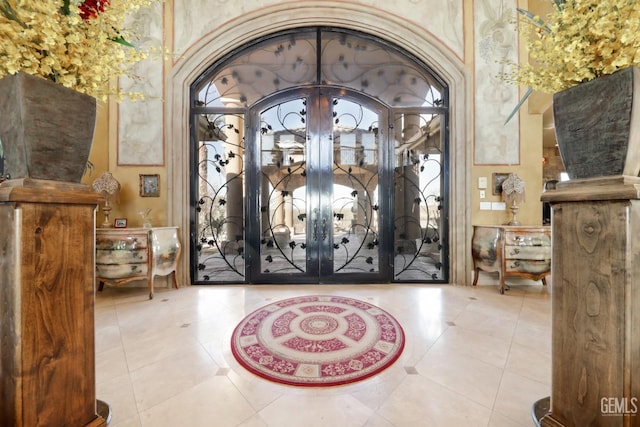 tiled entrance foyer with french doors