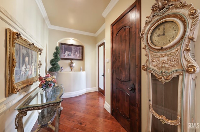 entrance foyer featuring dark hardwood / wood-style flooring and crown molding