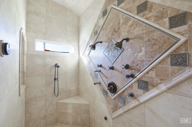 bathroom with tiled shower