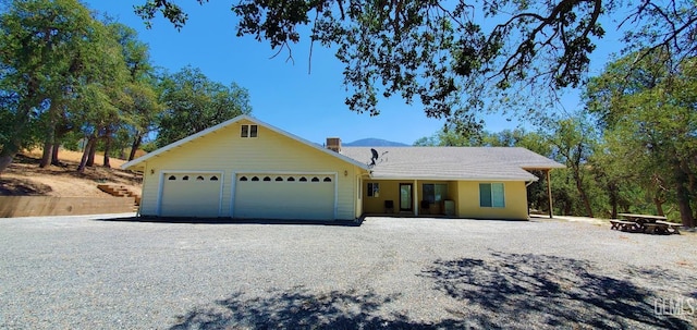 single story home with a garage