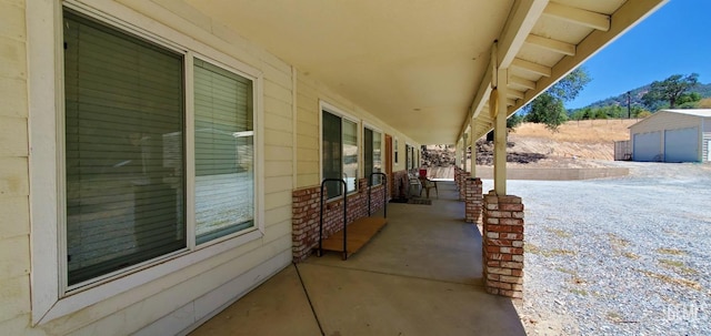 view of patio featuring an outdoor structure