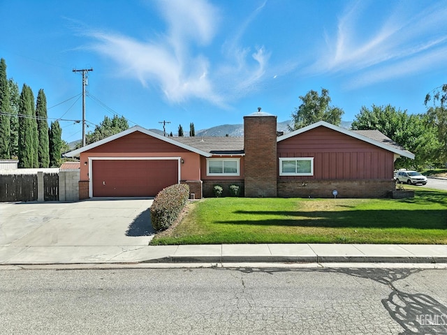 700 Mulberry St, Tehachapi, CA 93561 - single story home with a chimney, brick siding, an attached garage, and driveway