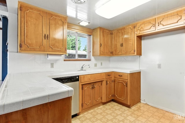 700 Mulberry St, Tehachapi, CA 93561 - kitchen featuring dishwasher, light flooring, tasteful backsplash, and tile countertops