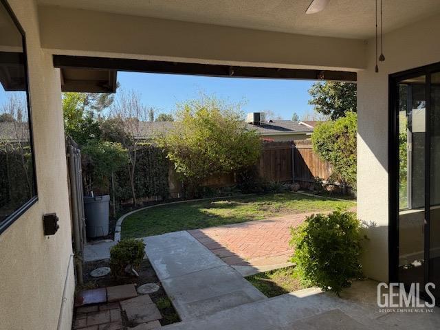 view of yard featuring a patio and a fenced backyard