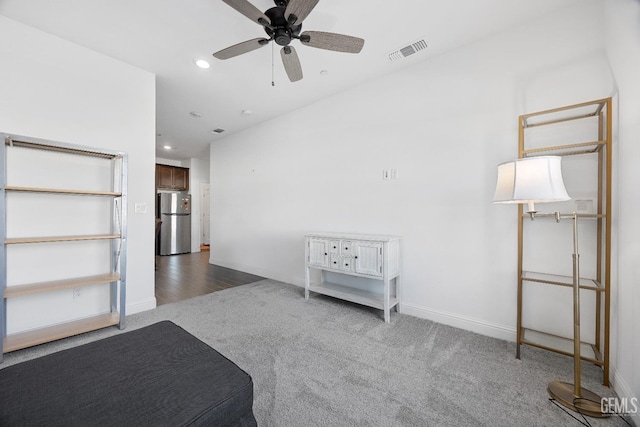 interior space featuring ceiling fan, recessed lighting, carpet flooring, visible vents, and baseboards