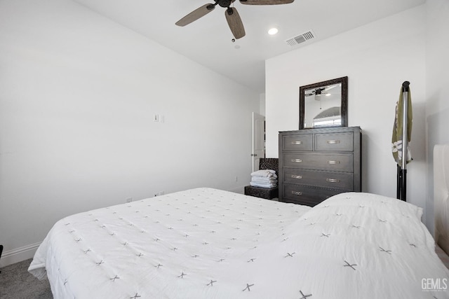 carpeted bedroom featuring ceiling fan and visible vents