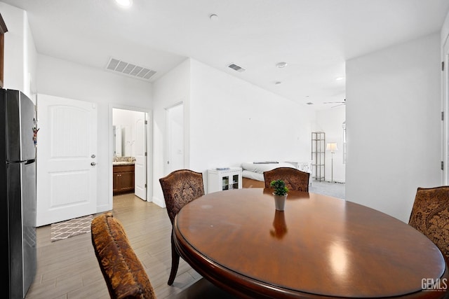 dining space with light wood-style flooring, visible vents, ceiling fan, and recessed lighting