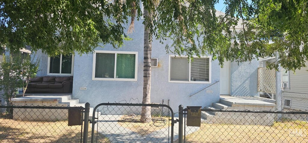 1822 Maple St, Bakersfield, CA 93304 - view of front of home featuring stucco siding