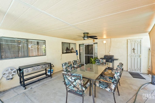 view of patio with a ceiling fan, outdoor dining space, and area for grilling